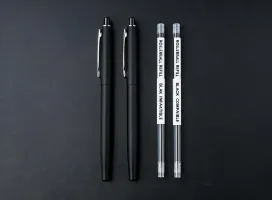 Cross rollerball pens beside ink refills